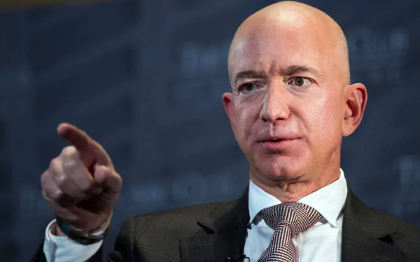 HD desktop wallpaper featuring a close-up of a man in a suit pointing, with a focused expression.