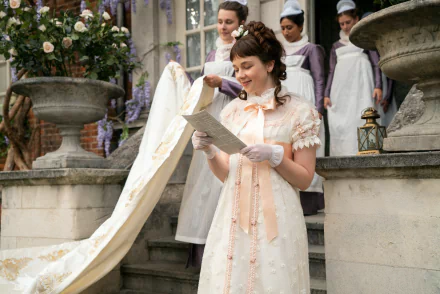 HD desktop wallpaper of a Bridgerton scene with a woman reading a letter, surrounded by others in period costumes.