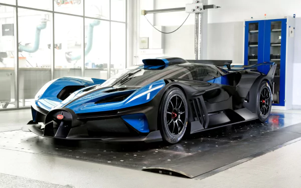 HD desktop wallpaper featuring a Bugatti Bolide in a sleek blue and black design, showcased in a modern garage setting.