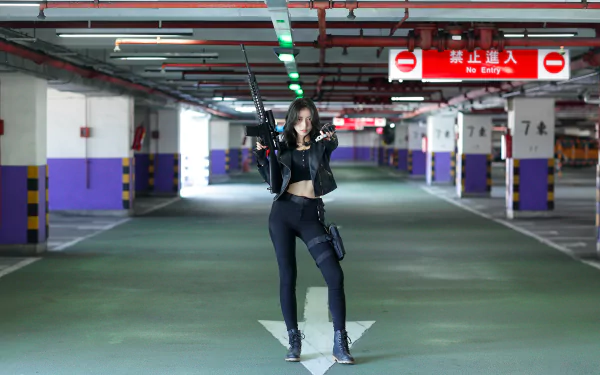 A confident Asian woman with black hair poses holding a gun in a dimly lit parking garage, captured in sharp focus with a blurred background in 4K Ultra HD.