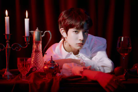 ENHYPEN member posing in a moody setting with candlelight for an HD desktop wallpaper and background.