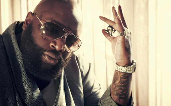 HD wallpaper featuring a stylish man in sunglasses gesturing a peace sign, suitable as a desktop background.