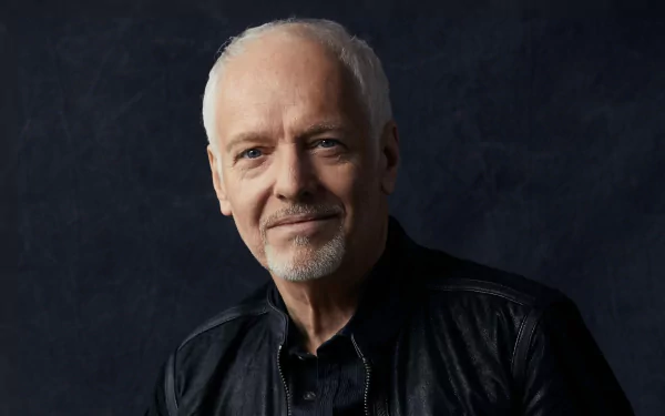 HD desktop wallpaper featuring a portrait of Peter Frampton against a dark background.