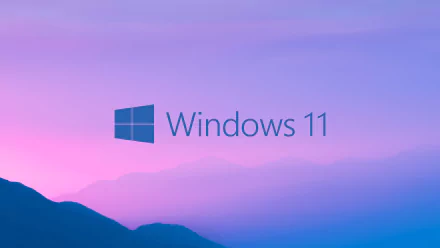 HD PC desktop wallpaper featuring the Windows 11 logo against a serene purple and blue gradient sky, symbolizing modern technology and innovation.
