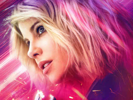 HD desktop wallpaper close-up of Lindy from the movie Jolt — blonde, tousled hair, intense gaze framed by neon pink streaks and cinematic sparks, moody action-movie vibe.