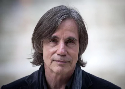 HD desktop wallpaper and background featuring a portrait of a man with shoulder-length hair and a black shirt, tagged as a musician.