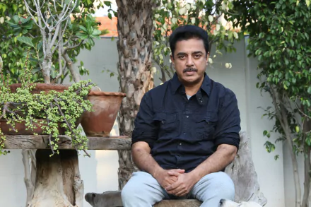 HD desktop wallpaper featuring a person sitting on a bench with a serene garden background for a calm and inspirational setting.