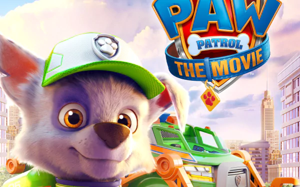 HD PC desktop wallpaper/background of Paw Patrol: The Movie — a smiling pup in a green cap, the movie logo, a rescue vehicle and a sunlit city skyline.