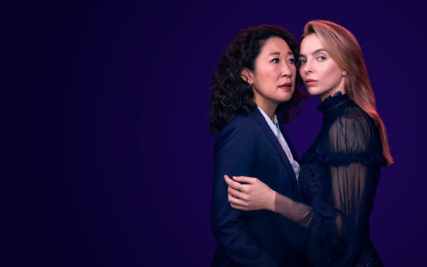 4K Ultra HD PC desktop wallpaper for TV show Killing Eve: two women—one with curly dark hair, one with straight blonde hair—embracing against a deep purple background.