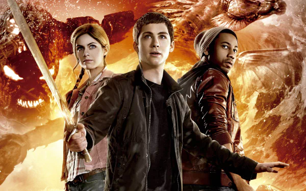 HD desktop wallpaper featuring Brandon T. Jackson, Alexandra Daddario, and Logan Lerman from the movie Percy Jackson: Sea of Monsters against a fiery, mythical background.