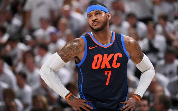 Basketball player in OKC jersey number 7 standing confidently on the court as a high-definition desktop wallpaper background.