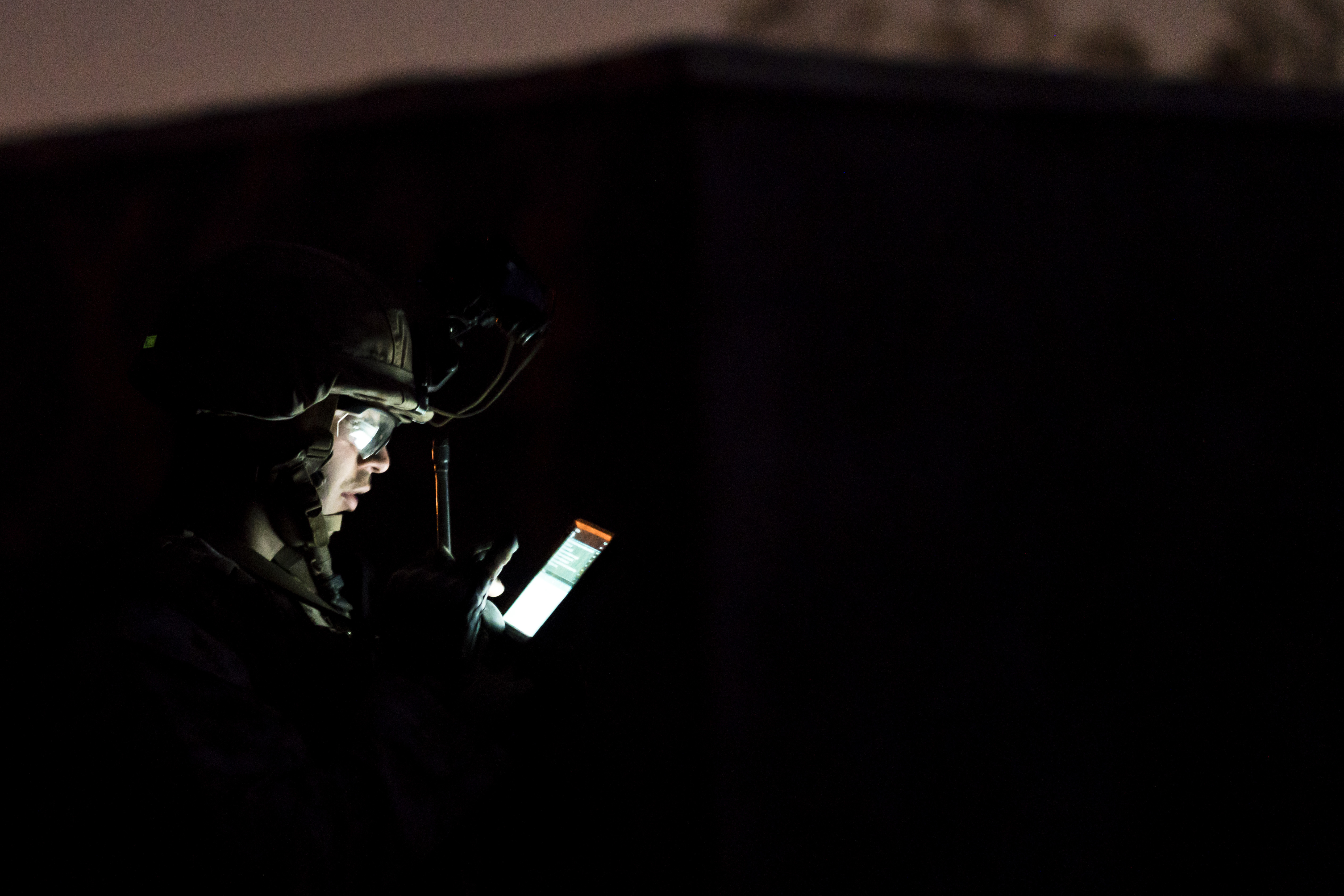 A U.S. Marine with the 2nd Battalion, 6th Marine Regiment uses a tablet during a simulated raid