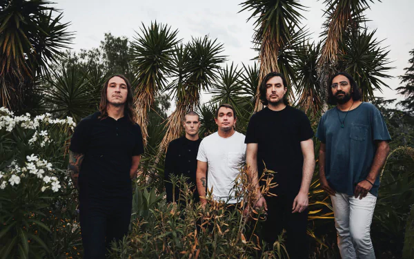 HD desktop wallpaper featuring a group of five band members standing confidently outdoors with tropical plants in the background, tagged with Deafheaven.