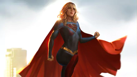 A 4K Ultra HD PC desktop wallpaper featuring Supergirl in a dynamic pose, with her red cape flowing against a bright, cityscape background in comic style.