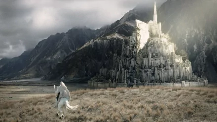 A panoramic view of Minas Tirith, featuring Gandalf on a white horse, captures the majestic architecture and dramatic landscape from *The Lord of the Rings: The Return of the King*.