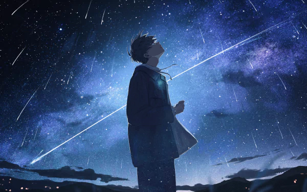 An anime boy stands beneath a starry night sky, captivated by shooting stars and a galactic backdrop, creating a stunning 4K Ultra HD desktop wallpaper.