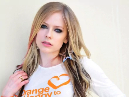 HD desktop wallpaper of musician Avril Lavigne, featuring her with long hair and stylish earrings, against a plain background.