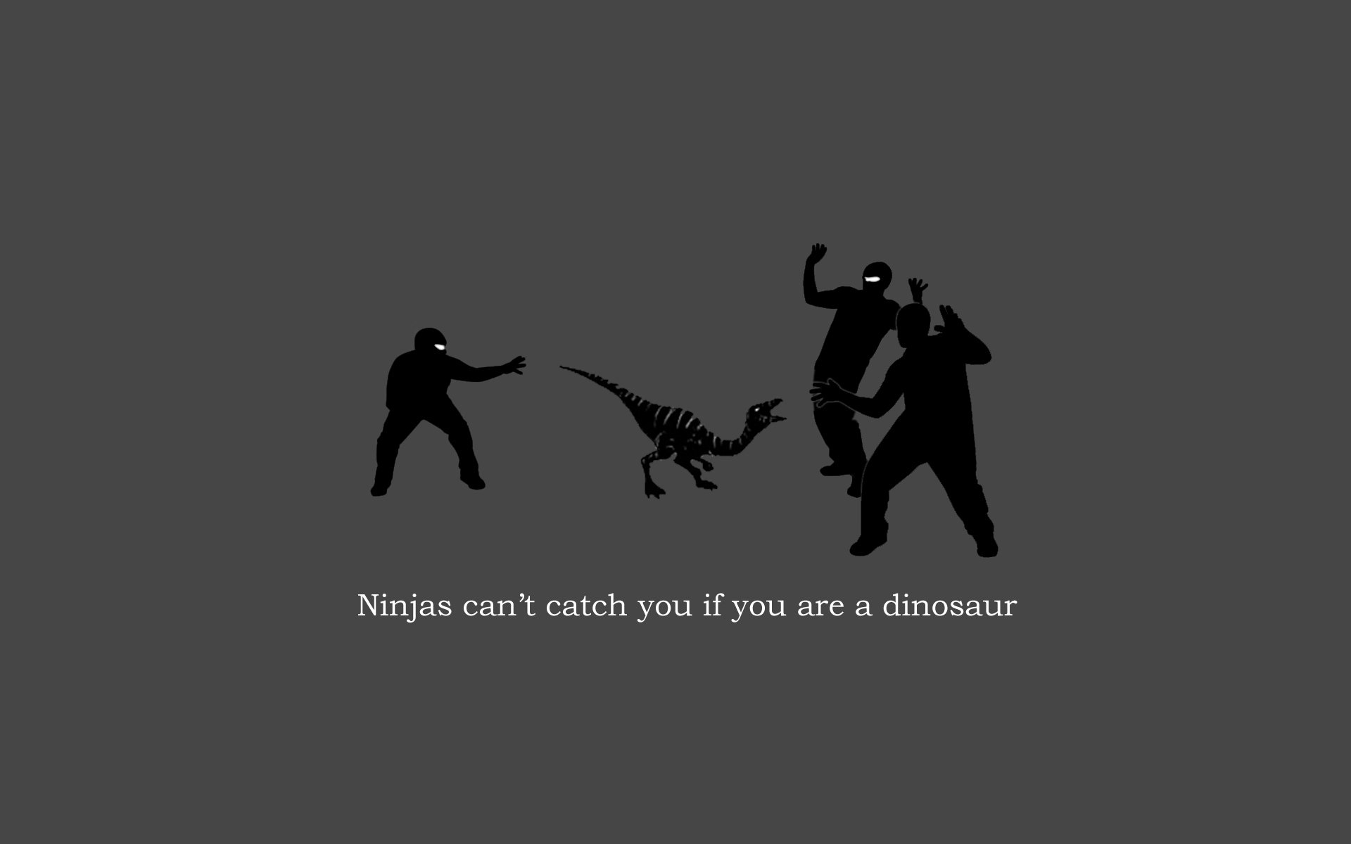 Funny HD PC desktop wallpaper showing a dinosaur easily escaping two ninjas, with the caption Ninjas can't catch you if you are a dinosaur.