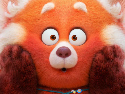 HD PC desktop wallpaper featuring the close-up of the red panda from the movie Turning Red, showcasing its wide eyes and surprised expression.