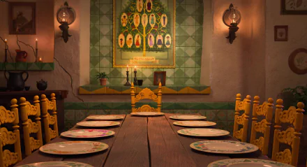 Encanto movie 2K Quad HD PC desktop wallpaper: warm tiled dining room with a long wooden table, yellow carved chairs, place settings, candles, and a glowing family-tree portrait on the wall.