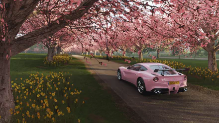 A pink sports car drives along a tree-lined path with blooming sakura flowers in the vibrant HD Forza Horizon 4 video game desktop wallpaper.