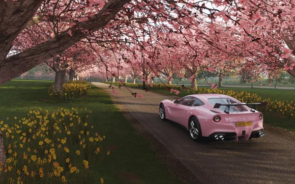 A pink sports car drives along a tree-lined path with blooming sakura flowers in the vibrant HD Forza Horizon 4 video game desktop wallpaper.