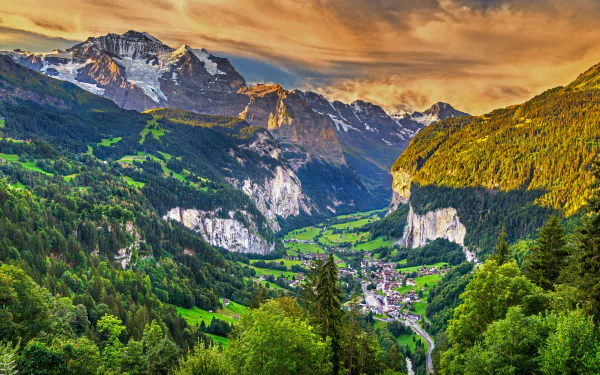 Lush Lauterbrunnen valley in the Alps under a glowing sunset, captured in stunning detail for an 8K Ultra HD desktop wallpaper and background.
