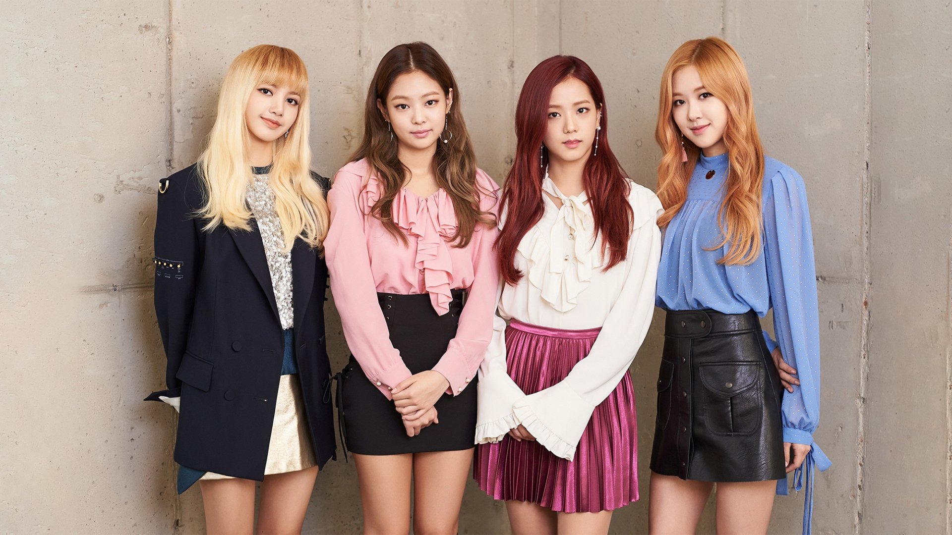 HD PC desktop wallpaper featuring the four members of BlackPink standing against a neutral background, showcasing stylish outfits and confident poses in a music-themed image.