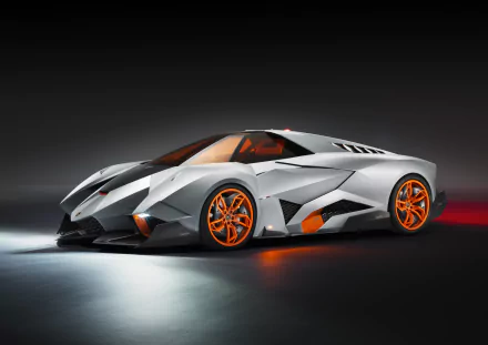 HD desktop wallpaper featuring the Lamborghini Egoista, showcasing its futuristic design and silver exterior with striking orange accents.
