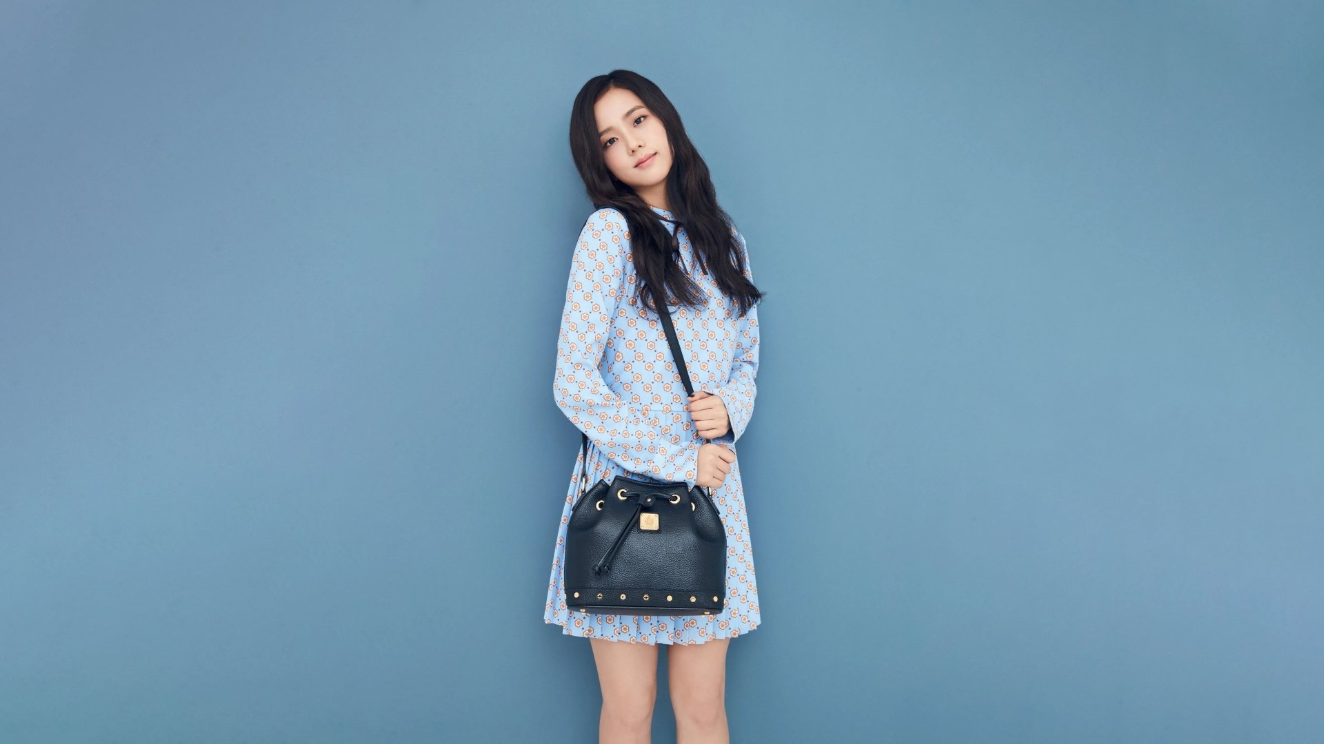 Jisoo from BlackPink poses against a blue backdrop in a 4K Ultra HD music-themed desktop wallpaper.