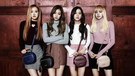 4K Ultra HD desktop wallpaper featuring the four members of BlackPink standing against a wooden background, showcasing their distinct styles in a music-themed image.