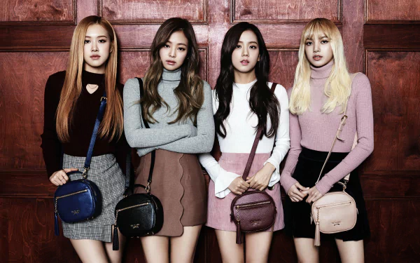 4K Ultra HD desktop wallpaper featuring the four members of BlackPink standing against a wooden background, showcasing their distinct styles in a music-themed image.