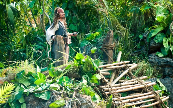 Jack Sparrow, portrayed by Johnny Depp, stands amidst lush greenery in a scene from Pirates of the Caribbean: On Stranger Tides, showcased in this vibrant 4K Ultra HD desktop wallpaper.