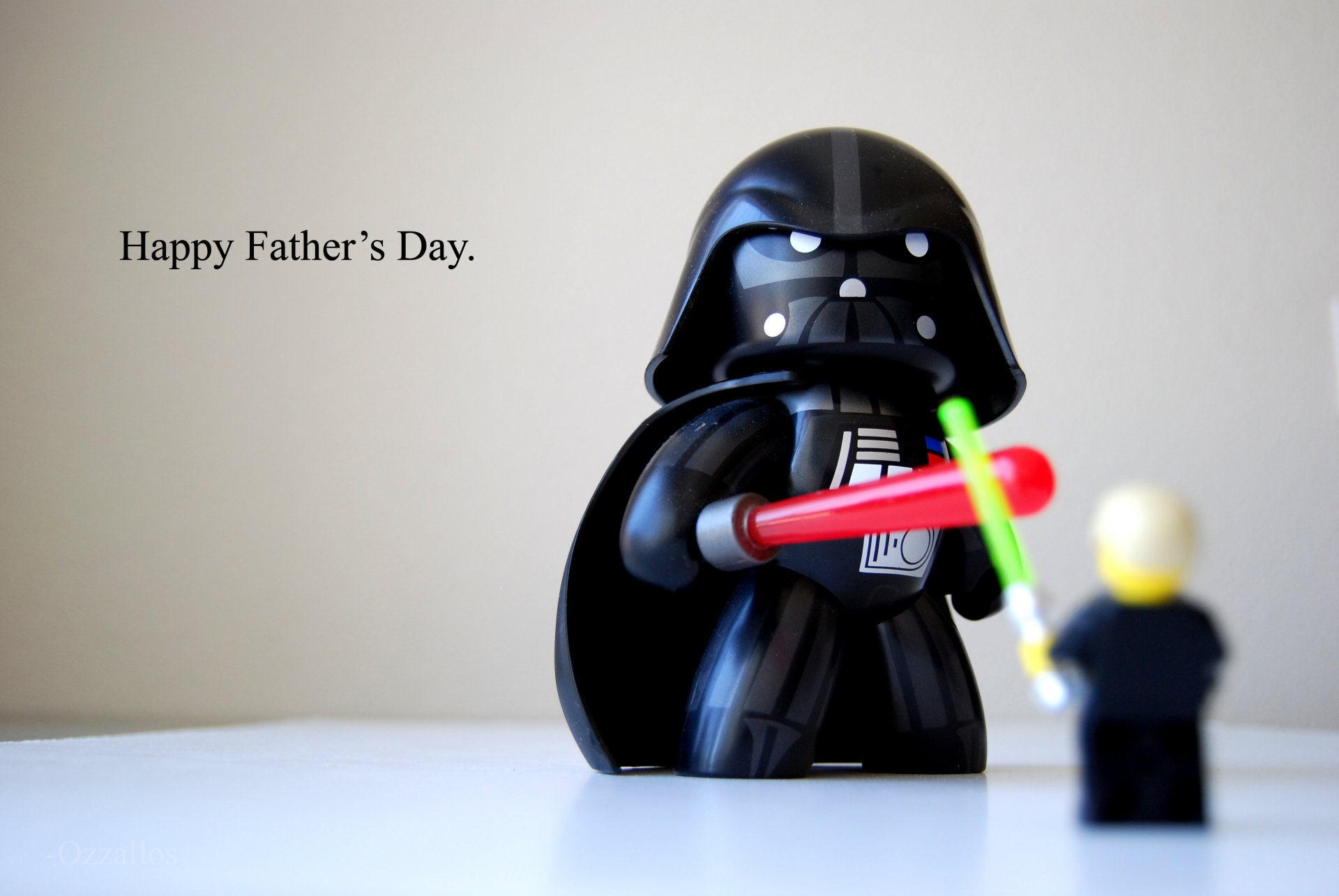 A humorous HD wallpaper featuring a playful Darth Vader figure and a small character, celebrating Father's Day with the text Happy Father's Day.