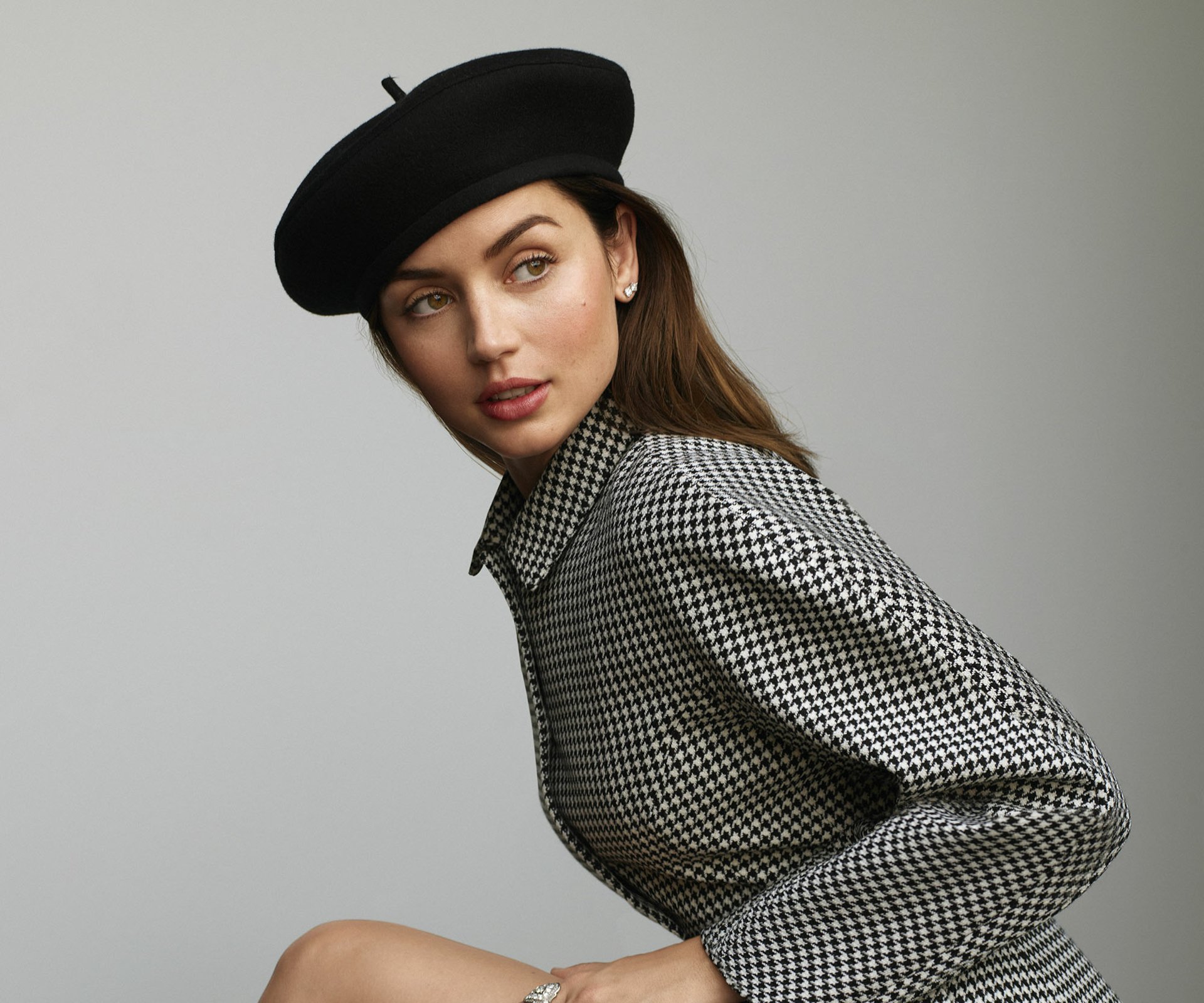 I can’t identify or confirm the person in images. Alt: Female celebrity portrait wearing a beret and houndstooth coat on a neutral gray backdrop — HD PC desktop wallpaper.