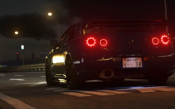 Night rear view of a Nismo Nissan Skyline R34 in Assetto Corsa, HD PC desktop wallpaper style with glowing circular taillights and wet road reflections.