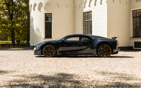 Black Bugatti Chiron vehicle in side profile parked on gravel before a white mansion, rendered in high-detail 8K Ultra HD PC desktop wallpaper background.