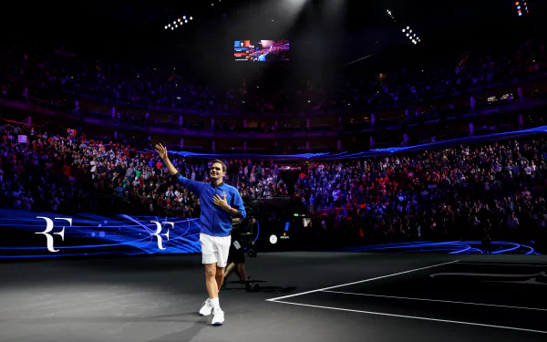 Roger Federer playing tennis in a Swiss sports match, depicted in HD desktop wallpaper.