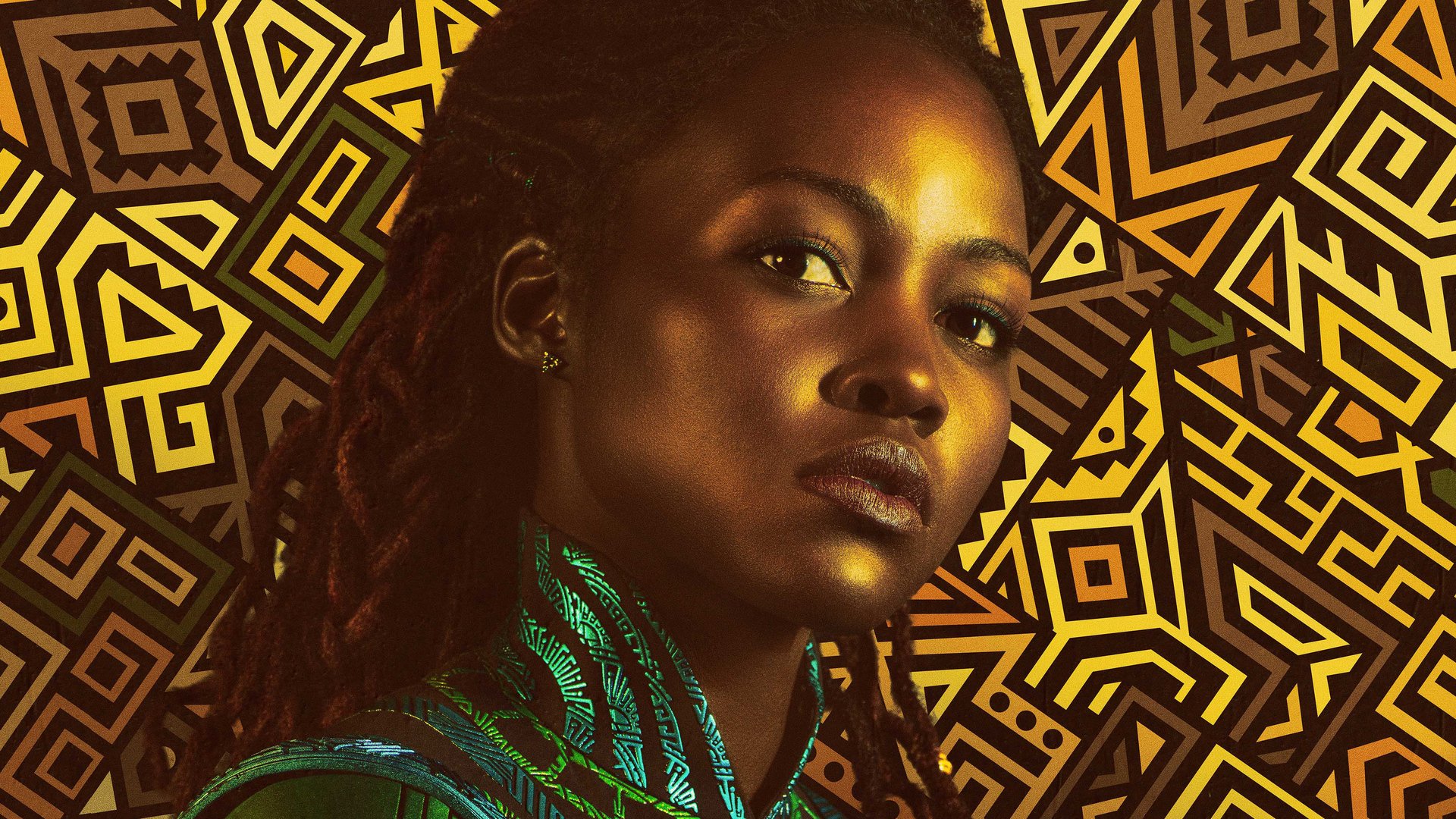 Close-up portrait of Nakia (Marvel Comics) from Black Panther: Wakanda Forever — HD movie desktop wallpaper showing her in green attire against a gold geometric Wakandan pattern.
