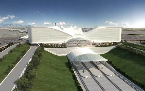 Artistic HD PC desktop wallpaper showcasing a modern, futuristic building with sleek white curves and a green landscape under a clear blue sky.