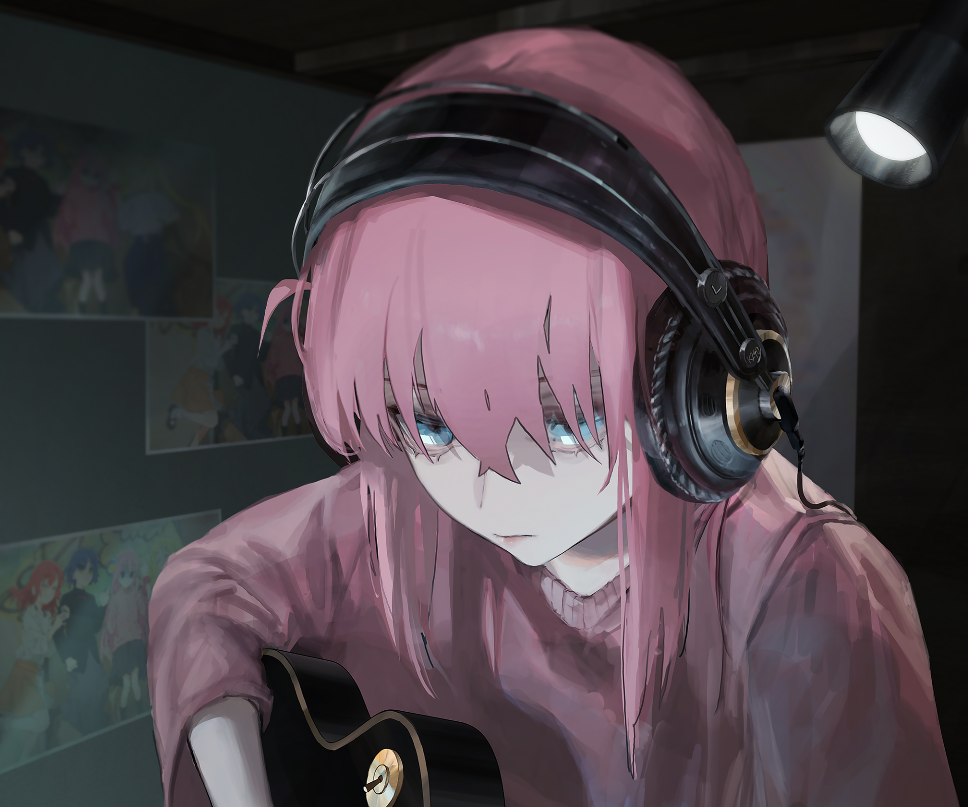 HD desktop wallpaper featuring Hitori Gotou from the anime Bocchi the Rock!, concentrating deeply while playing guitar with headphones on. The background shows posters on a dark wall.