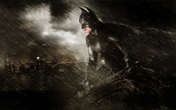 Dark and brooding HD wallpaper featuring Batman from the movie Batman Begins - perfect for fans of the caped crusader.