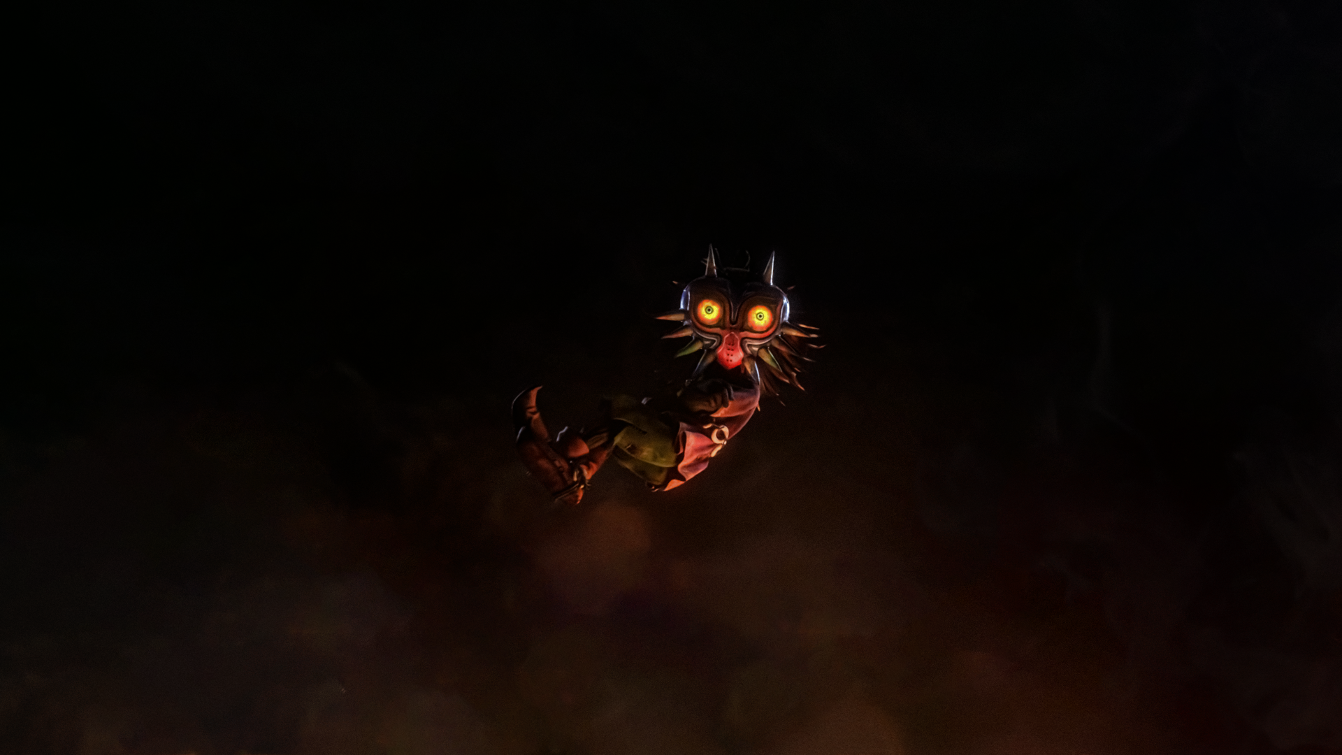 An 8K Ultra HD PC desktop wallpaper featuring Majora's Mask from The Legend of Zelda video game series against a dark, smoky background.