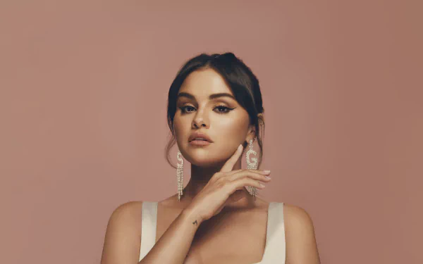 High-resolution 4K Ultra HD PC desktop wallpaper featuring Selena Gomez against a muted brown background, highlighting her music career.