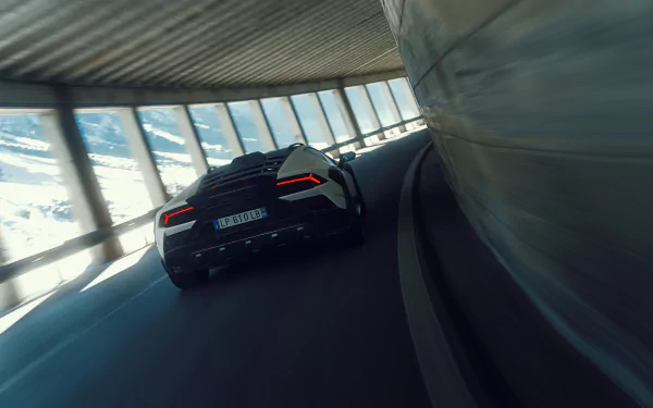Lamborghini Huracán Sterrato roaring on a winding road in stunning HD wallpaper.