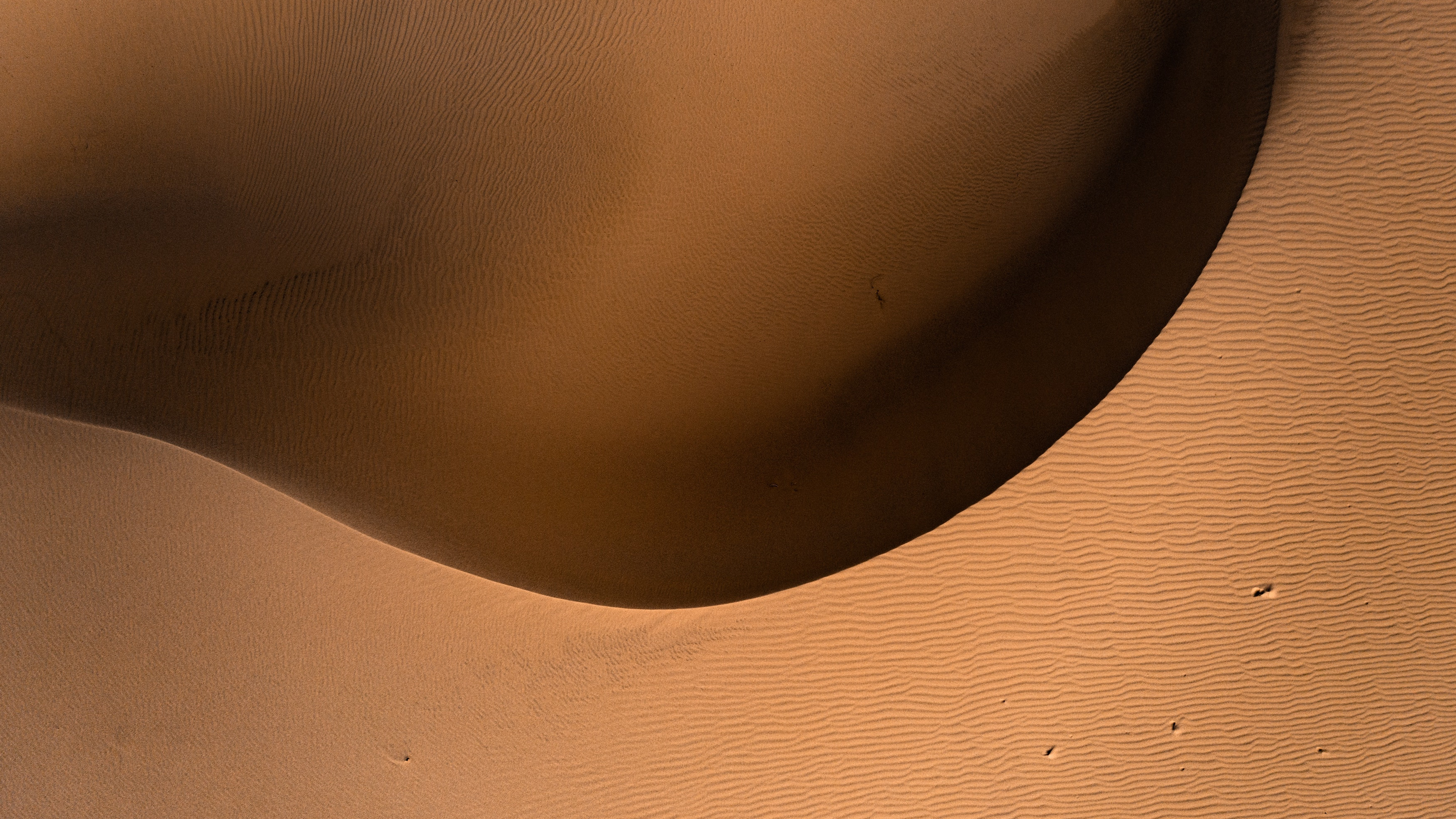 Aerial Shot of the Desert Smooth Sand in Guadalupe, California, USA by Jeremy Bishop