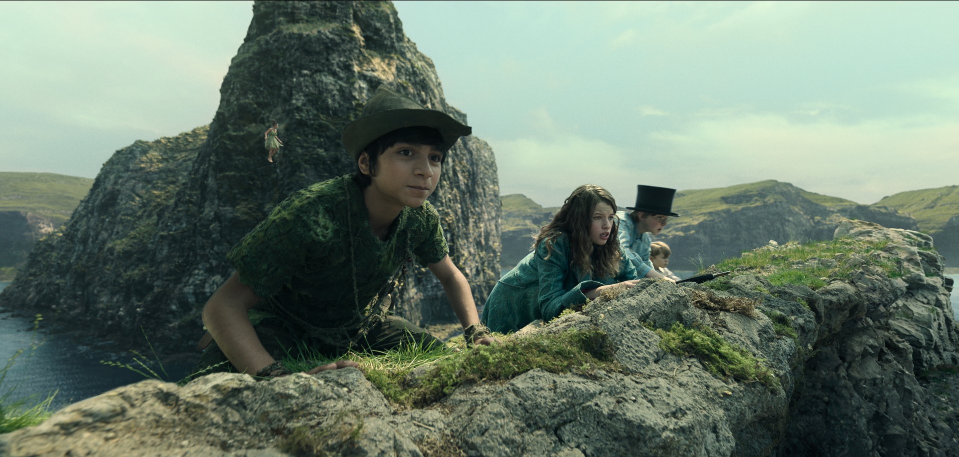 HD desktop wallpaper featuring characters resembling Peter Pan and Wendy hiding behind rocky terrain in a whimsical adventure setting.