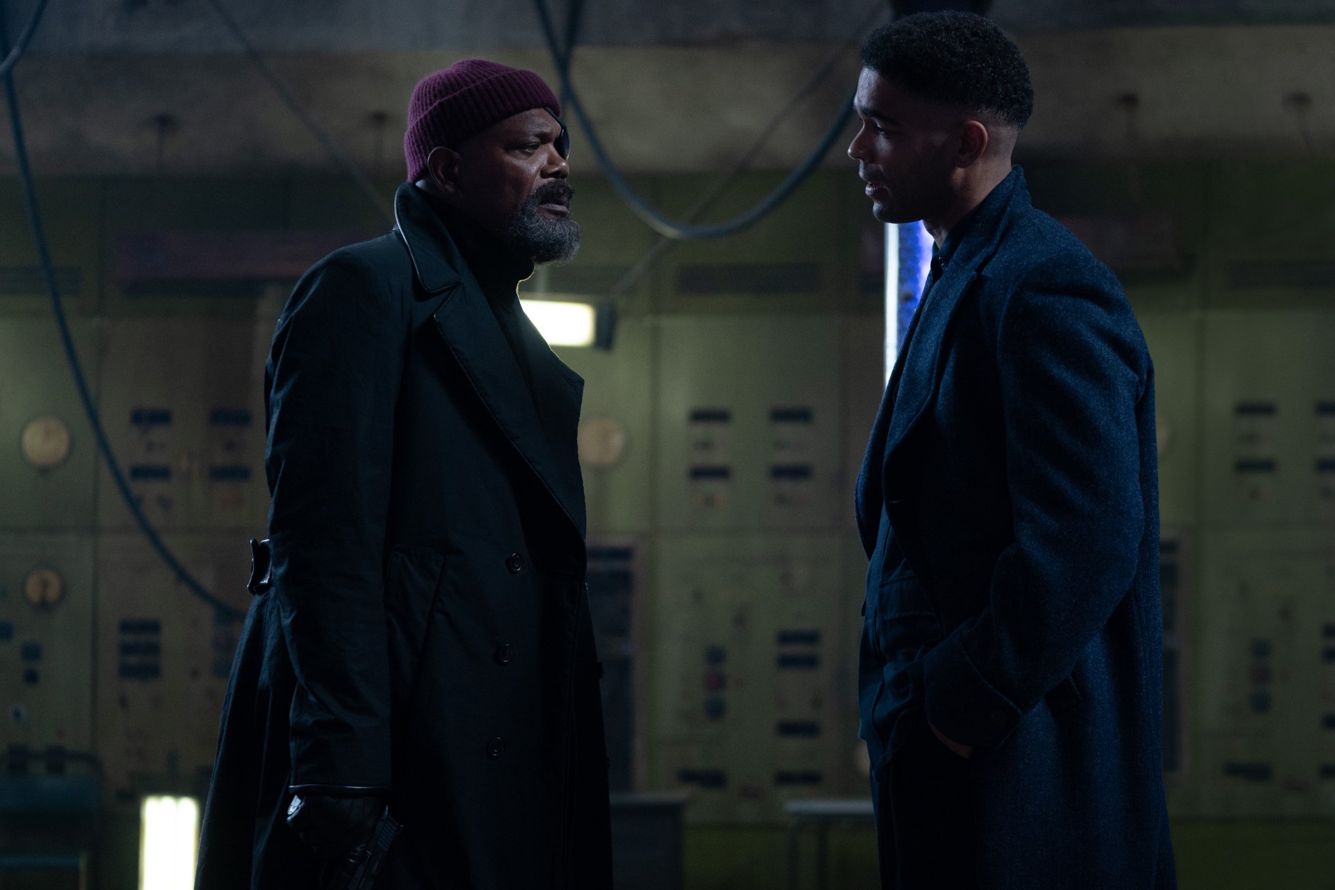 A dramatic scene from the TV show Secret Invasion, featuring Nick Fury, portrayed by Samuel L. Jackson, in a tense conversation with another character. High-definition wallpaper.