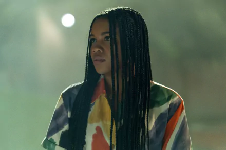 HD wallpaper of a scene from Insidious: The Red Door featuring a character with braided hair in a colorful jacket, evoking a suspenseful atmosphere.