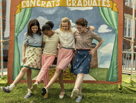 HD wallpaper featuring a happy group of friends from Are You There God? It's Me, Margaret leaning on a colorful playhouse with a painted backdrop.